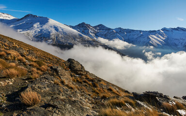 Sierra Nevada National Park. Mountain climate with clouds and snow on the slopes of the Mulhacen peak. Granada