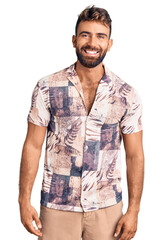 Young hispanic man wearing summer clothes with a happy and cool smile on face. lucky person.