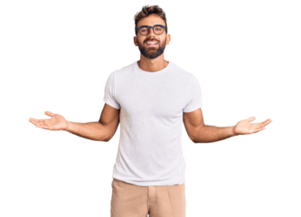 Young hispanic man wearing casual clothes and glasses smiling showing both hands open palms, presenting and advertising comparison and balance
