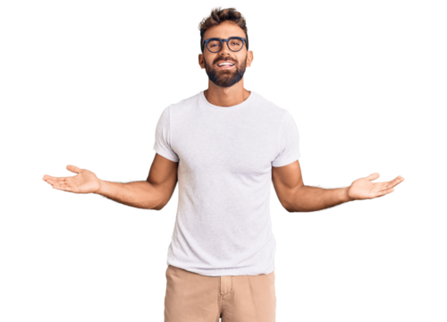 Young hispanic man wearing casual clothes and glasses smiling showing both hands open palms, presenting and advertising comparison and balance
