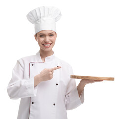 Happy woman chef in uniform pointing at empty wooden board on white background