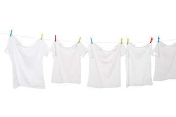 Many t-shirts drying on washing line isolated on white