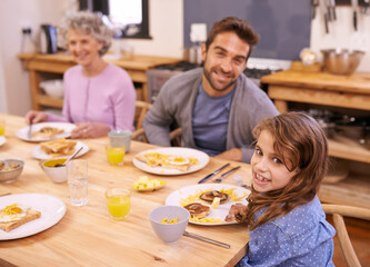 Love, breakfast and family in portrait or kitchen with food, eating or bonding together at table. Meal, pancakes and father or grandmother with child for brunch, nutrition or communication at home