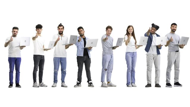 A group of people, full-length, on a white background, show a thumbs up with a laptop