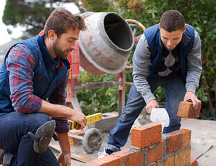 Men, tools and bricks in outdoor with cement for construction, building or masonry for job or...