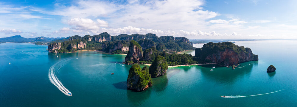 Aerial view Panorama of Ao Nang Island, Rai Lay Beach, Long Bay and passenger boat, tourist, Andaman Sea in the summer season at Krabi Province