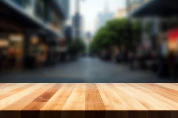 Foto op Canvas An empty wooden table in front of a blurred city street. High quality photo © oksa_studio