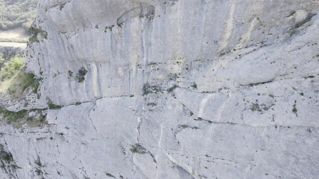 Aerial View Of Karst Cliff Wall Of Mountain In Daytime. - close up