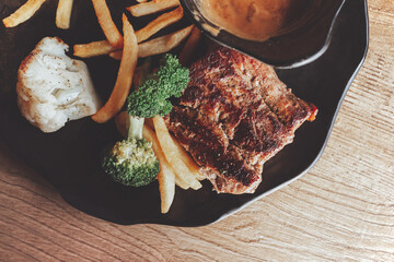 Tasty Grilled Meat with Fries and Vegetables - 767784878
