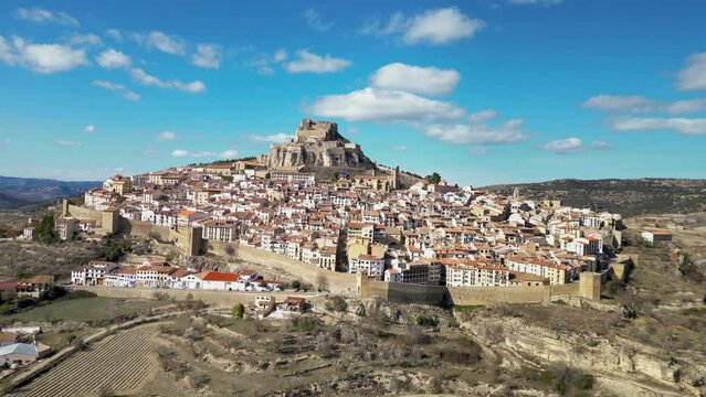 Cinematic aerial view of Morella city. Ancient walled city located on a hill-top in the province of Castell&oacute;n, Valencian Community, Spain. Drone going forward. Famous travel destination.