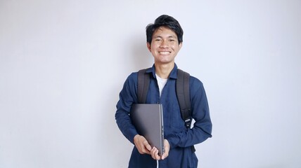young handsome asian student male happy holding laptop with isolated white background