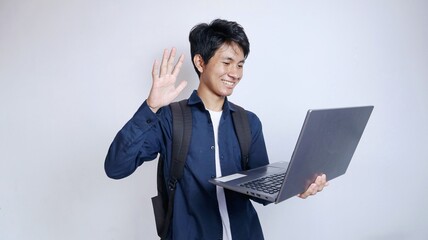 Handsome young Asian man holding laptop video call, meeting
