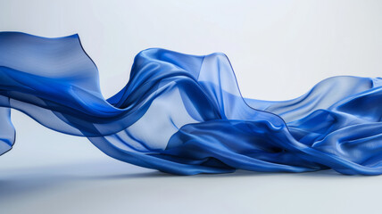 Elegant blue fabric billowing gracefully, resembling ocean waves.
