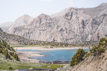 View of Lake Kulikalon and the Kulikalon Basin from a mountainside in the Fan Mountains in Tajikistan, atmosphere in the Tien Shan highlands