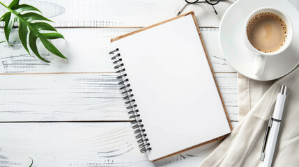 Blank notebook with cup of coffee and stationary on white wooden table. Space for text, flatlay, top view