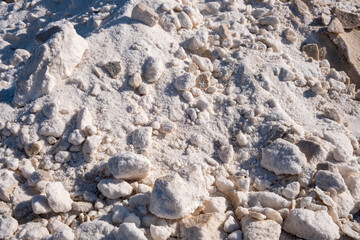 Mountains or piles of untreated salt.Salt industry. Salt flower. Industrial exploitation of salt growing in the pools of seawater between the marshes on the Atlantic coast.