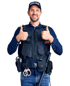 Young handsome man wearing police uniform success sign doing positive gesture with hand, thumbs up smiling and happy. cheerful expression and winner gesture.