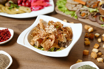 Wooden Table Adorned With Delicious Bowls of Food