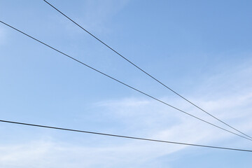 Cables and Wires seen against Blue Sky