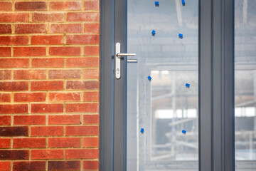 Window view of construction aparments building site in england uk.