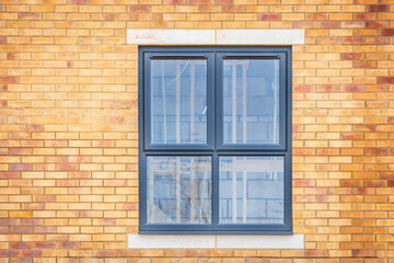 Window view of construction aparments building site in england uk.