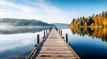 Foto auf Acrylglas Wooden pier leading into lake, surrounded by the beauty of nature, tranquil scenery © Daniel