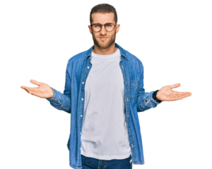 Young caucasian man wearing casual clothes clueless and confused with open arms, no idea concept.