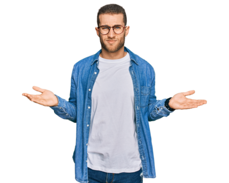 Young caucasian man wearing casual clothes clueless and confused with open arms, no idea concept.