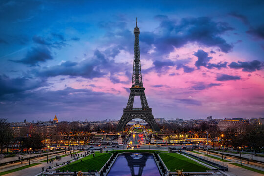 Beautiful spring dusk view of the Eiffel Tower and skyline of Paris, France