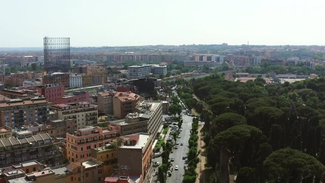 Aerial: Cars On Street Amidst Buildings And Trees In City - Rome, Italy