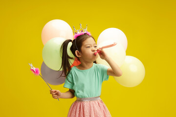 Birthday Girl with Balloons and Party Whistle Funny Celebrating Her Holiday on Yellow Isolated...