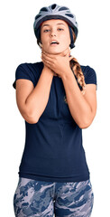 Beautiful caucasian woman wearing bike helmet shouting and suffocate because painful strangle. health problem. asphyxiate and suicide concept.