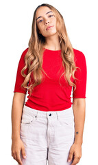 Fototapeta premium Young beautiful blonde woman wearing casual clothes relaxed with serious expression on face. simple and natural looking at the camera.