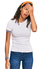Fototapeta premium Young african american girl wearing casual clothes yawning tired covering half face, eye and mouth with hand. face hurts in pain.
