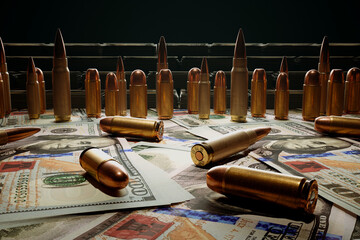 Close-Up of Bullets Scattered on Mixed US and International Currency Background