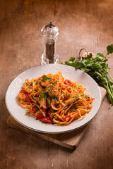 linguine with shrimp tomato sauce and parsley - 767836245