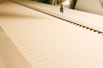CNC router machine creates a layout of the shelf complex.