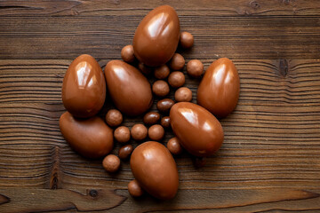 Chocolate eggs and sweets flat lay. Chocolates background