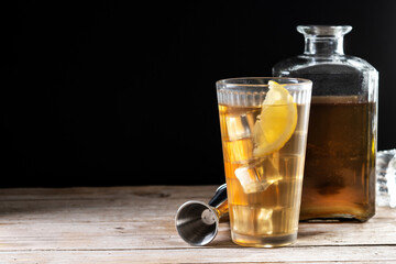 Highball, Whiskey with soda and lemon beverage on wooden table. Copy space