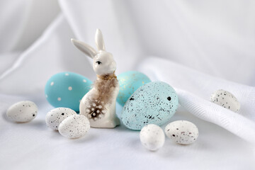 Easter composition with white rabbit and eggs on a white background. The minimal concept. - 767840424