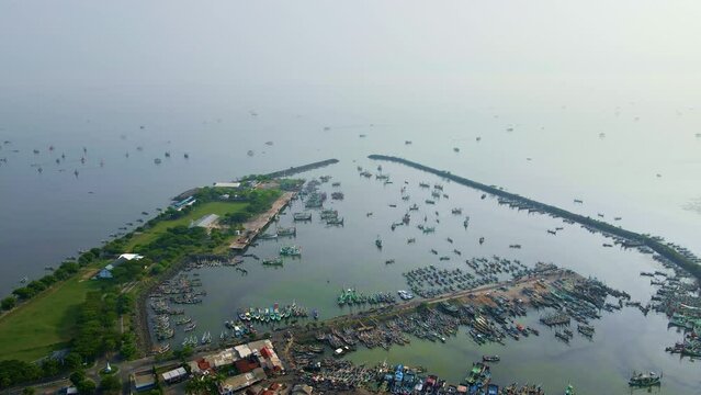 Muncar Harbor, the point of departure and arrival for traditional boats, a central docking point for these vessels after their fishing activi ies. It is the largest fishing industry in Java.