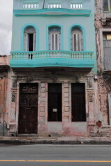 Neatly painted first floor of 1900s Eclectic style house contrasting with a chipped ground floor facade, San Lazaro Street. Havana Centro-Cuba-116 - obrazy, fototapety, plakaty