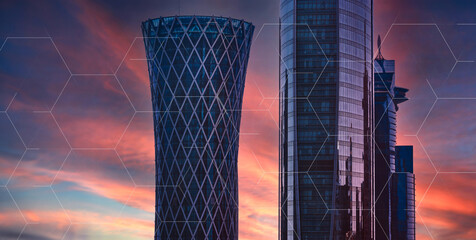 Doha, Qatar - February 2024. Business district buildings skyline. Modern glass skyscrapers at sunset
