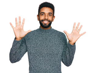 Young african american man wearing casual clothes showing and pointing up with fingers number ten while smiling confident and happy.