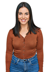 Young hispanic woman wearing casual clothes with a happy and cool smile on face. lucky person.