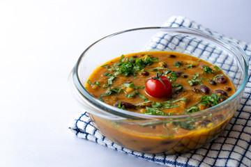 Homemade kidney bean curry or rajma or rajmah, a healthy North Indian vegetarian dish garnished...