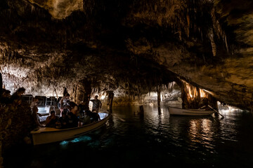 People on boats in amazing  Drach Caves, Mallorca, Spain