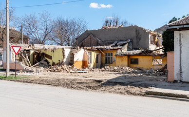 Obraz na płótnie Canvas Demolition of houses. Ruined one-story private house.