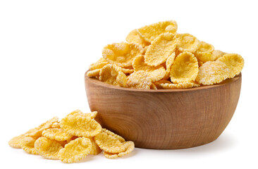 Corn flakes in a wooden plate and scattered on a white background. Isolated - 767862072