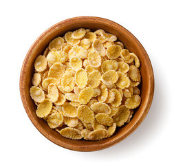Corn flakes in a wooden plate close-up on a white. Top view - 767863814